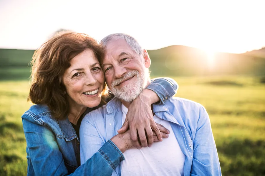 Happy senior couple outside